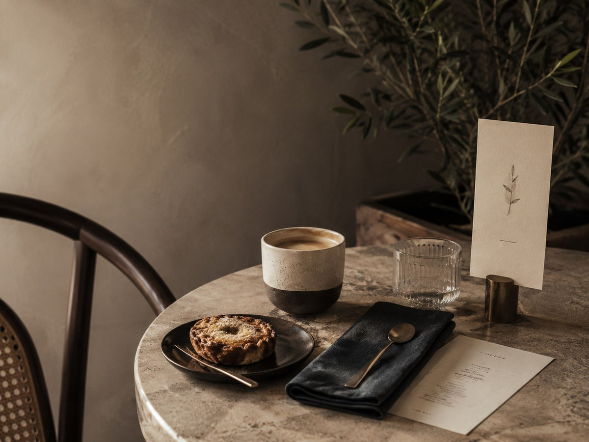 Boutique cafe table with branded hospitality details